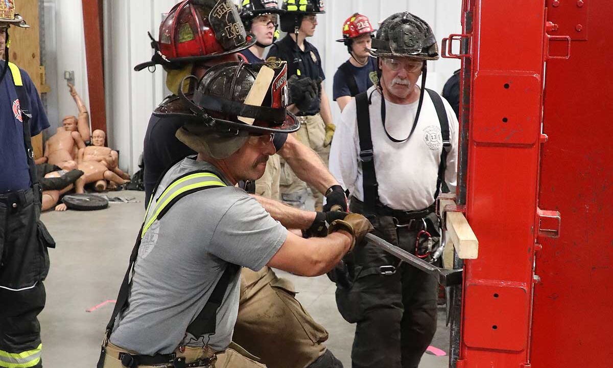 Firefighters trainin on door forcible entry