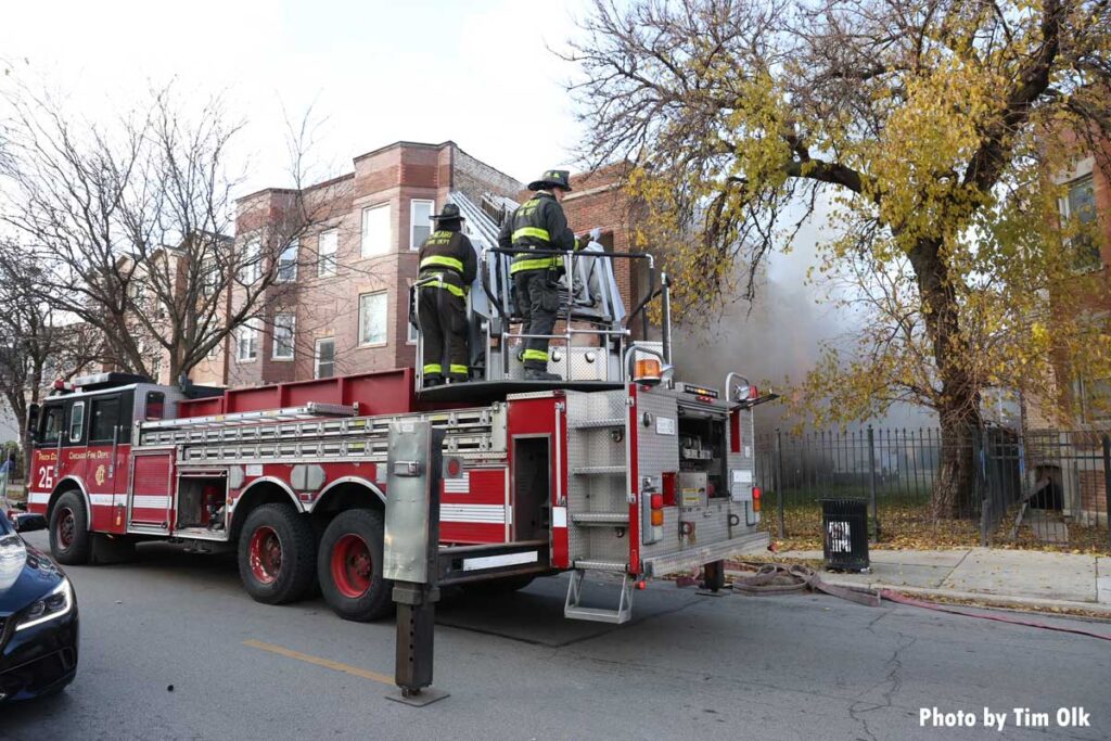 Chicago firefighters on aerial device at working fire 4008 W Jackson