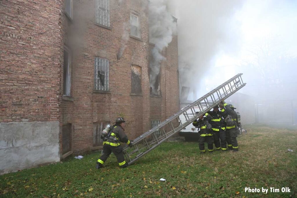 Chicago firefighters raise extension ladder