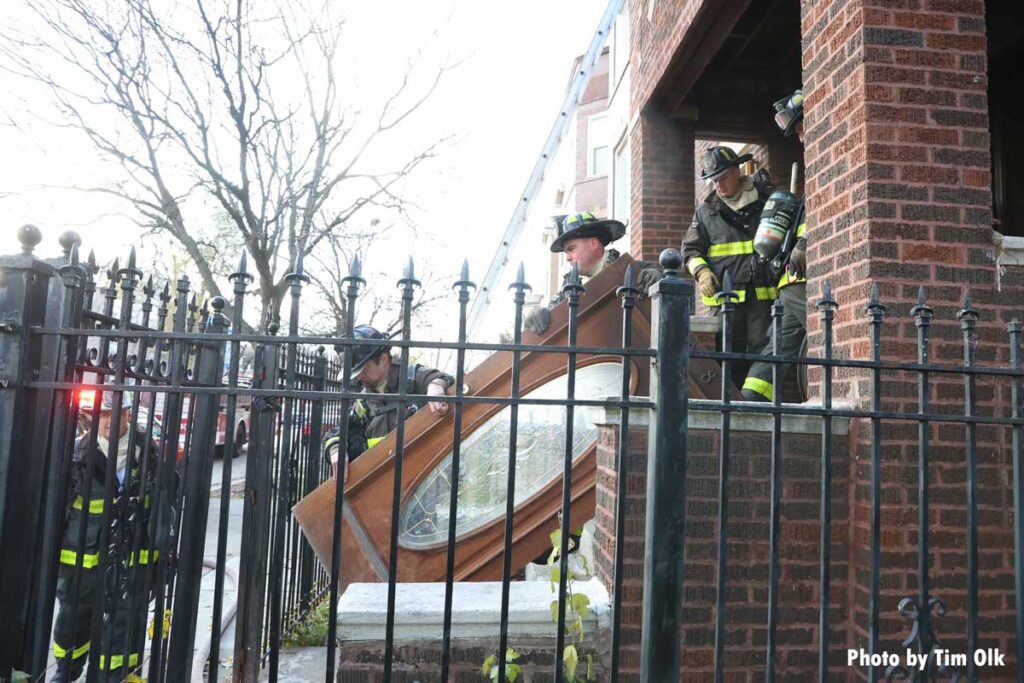 Chicago firefighters remove door from home