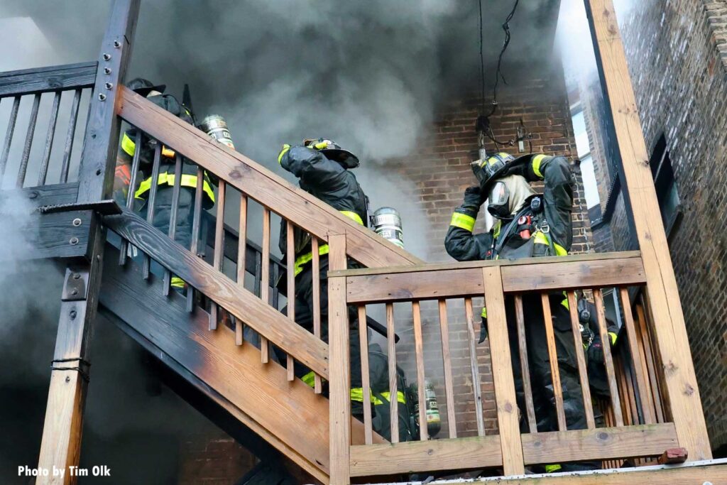 Chicago firefighters mask up on stairs