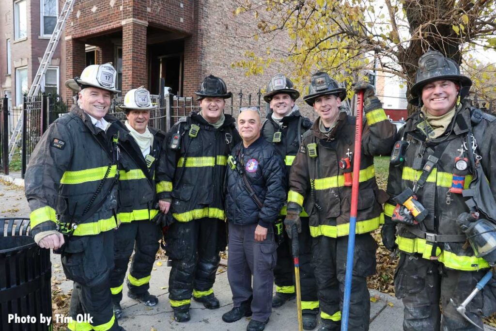 Chicago firefighters with tools at fire scene