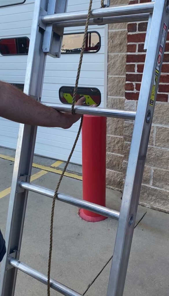 Push rope underneath rung of ladder