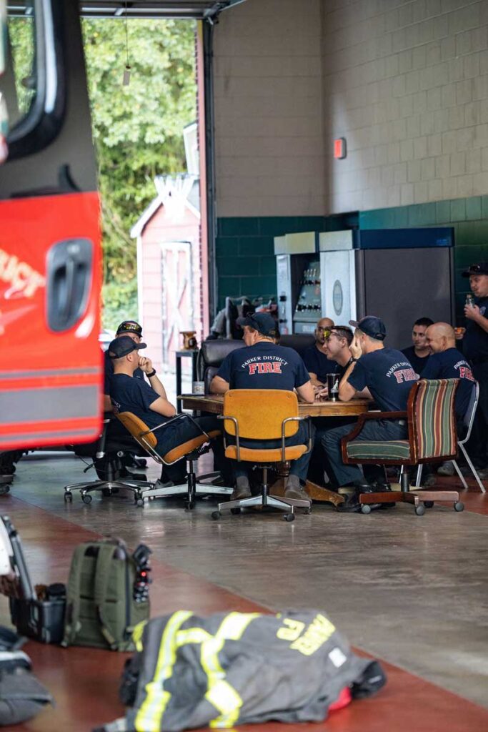 Firefighters at kitchen table