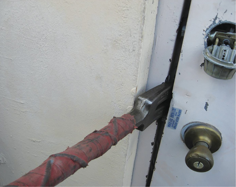 he prying action of the fork is restricted in this outward-swinging door 