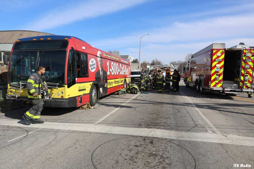 Indianapolis firefighters at bus rescue with fire apparatus