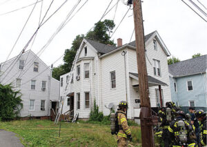 Firefighters in front of a home