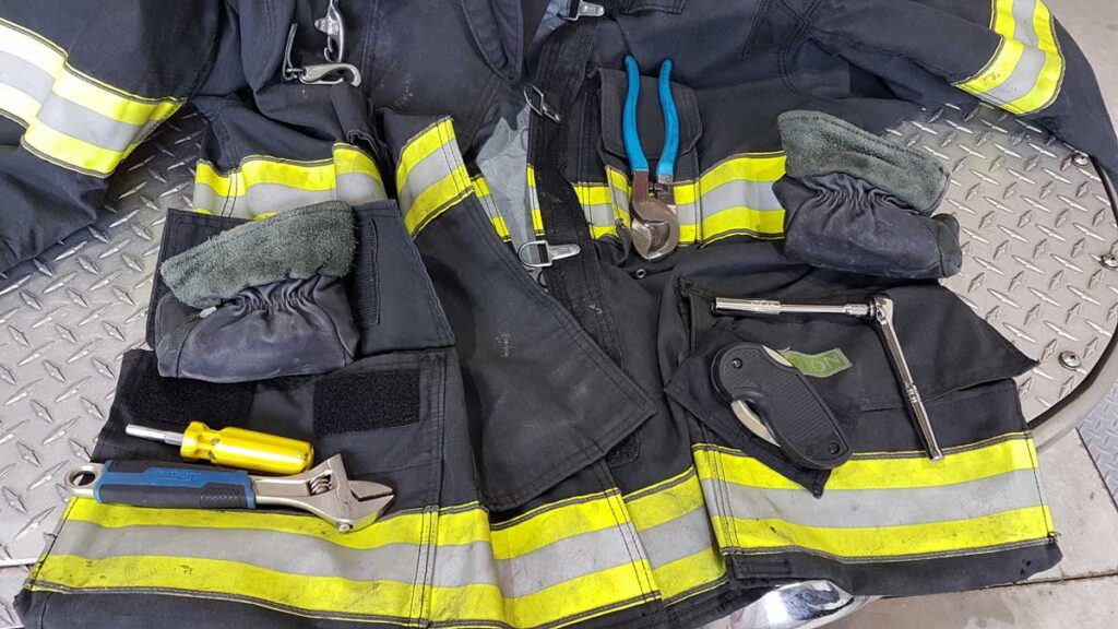 Firefighting tools in different pockets of PPE