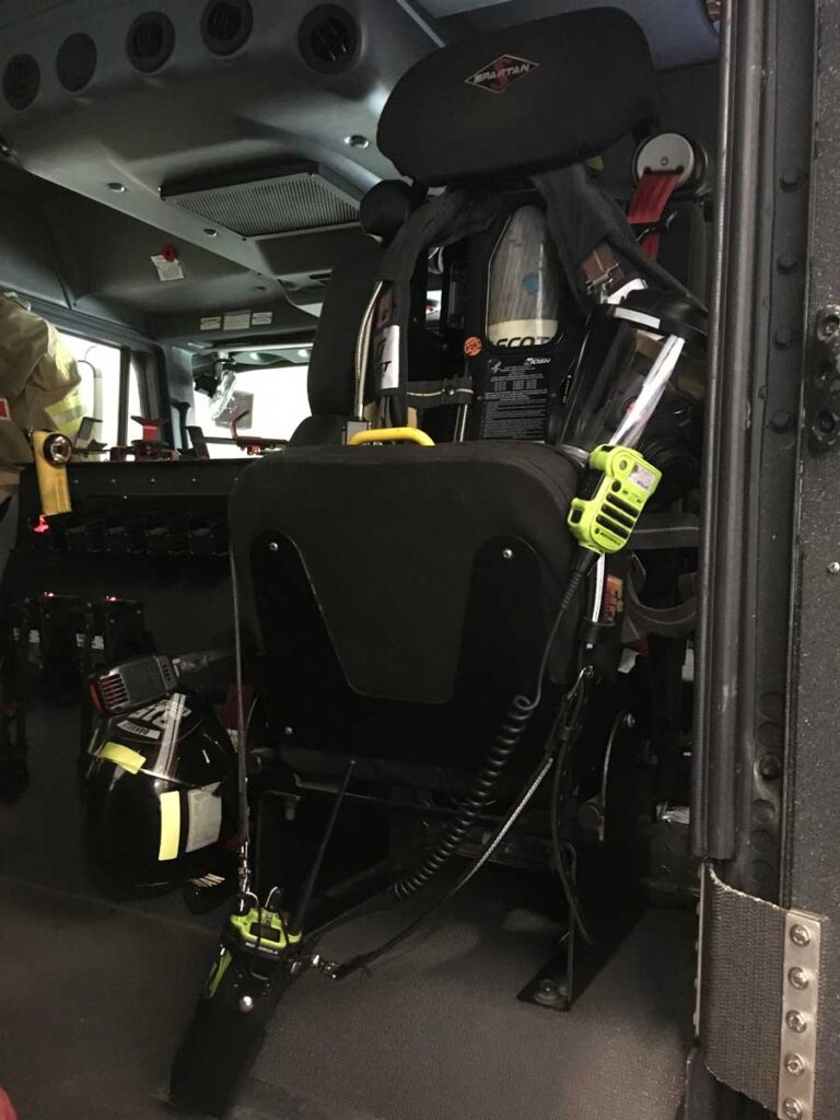 Firefighter radios and SCBA ready to go in seat of apparatus