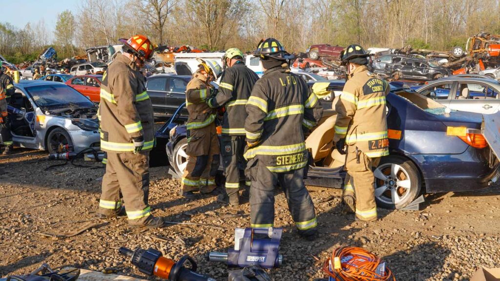 Firefighters training on a vehicle extrication FDIC 2024