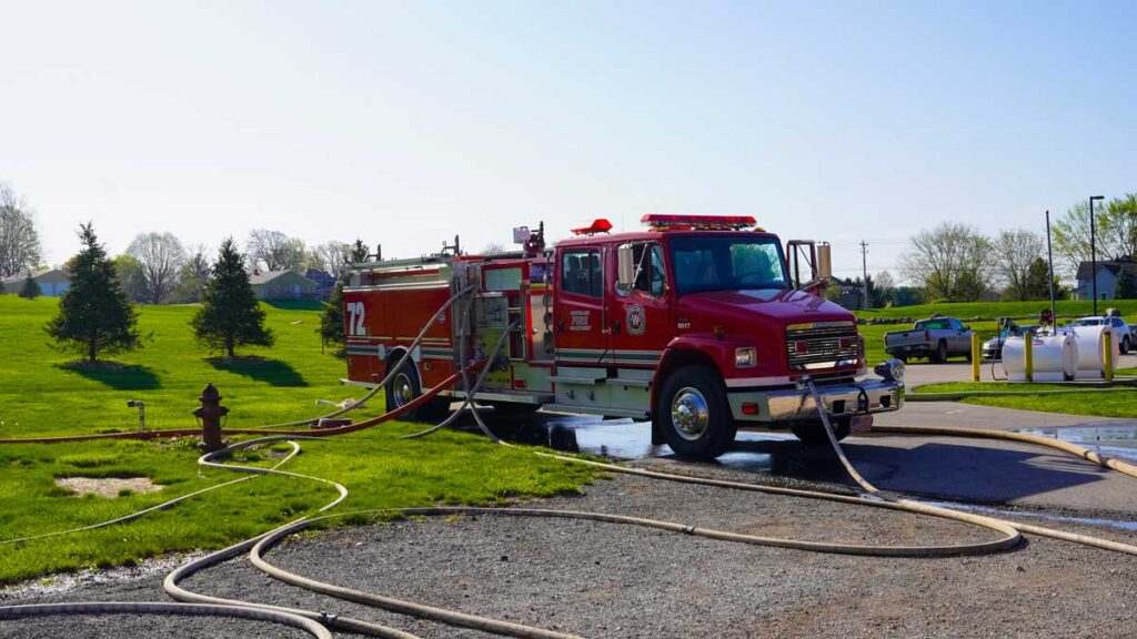 Fire truck pumping multiple hoselines