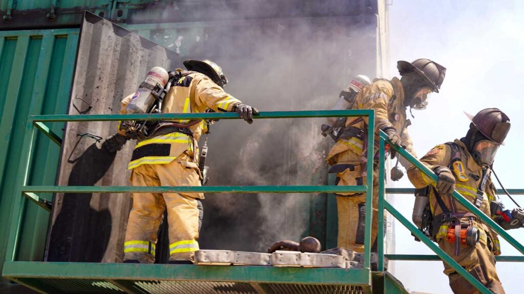 Firefighters leaving a burn building