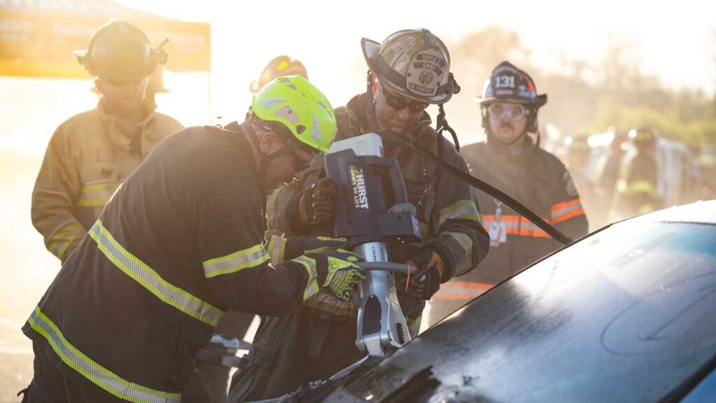 Firefighters use jaws of life during extrication training FDIC 2024