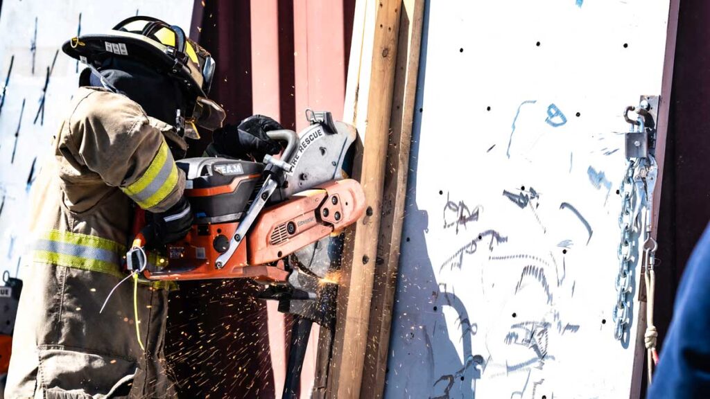 Firefighter using a rotary saw