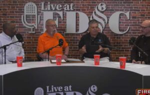 Tom Aurnhammer and Ron Kanterman talk with guests at FDIC 2024