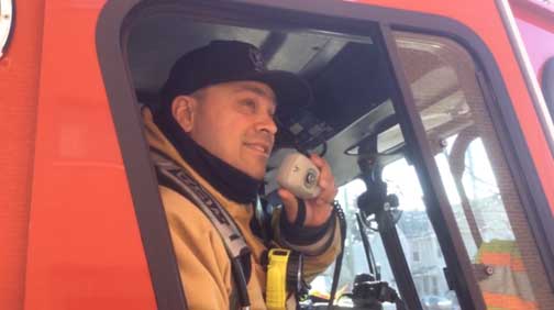 Firefighter talking on the radio