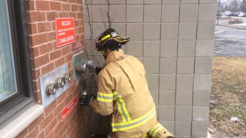 Firefighter checks FDC