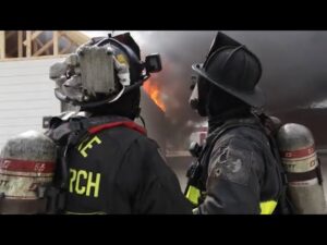 FDIC 2024 Firefighters looking at flames