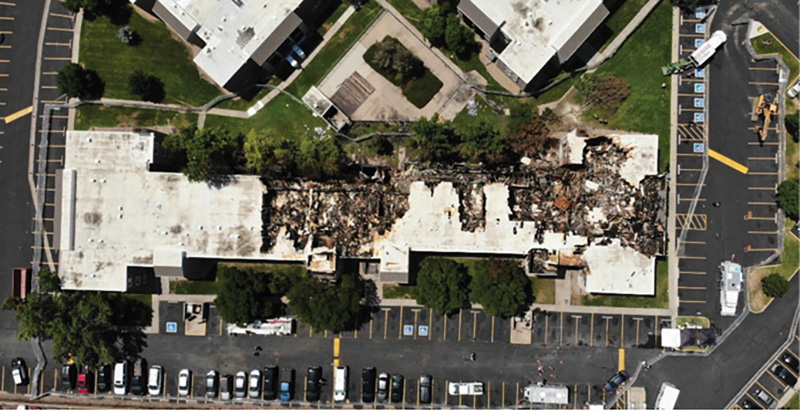 Overhead view of garden apartment fire scene