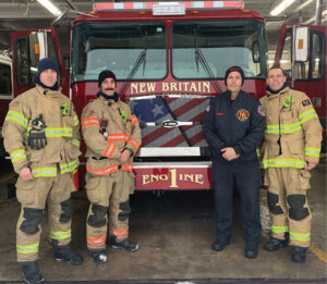 Firefighters in front of rig