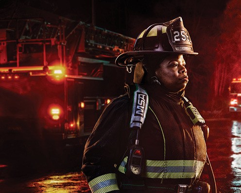 firefighter in MSA Cairns helmet