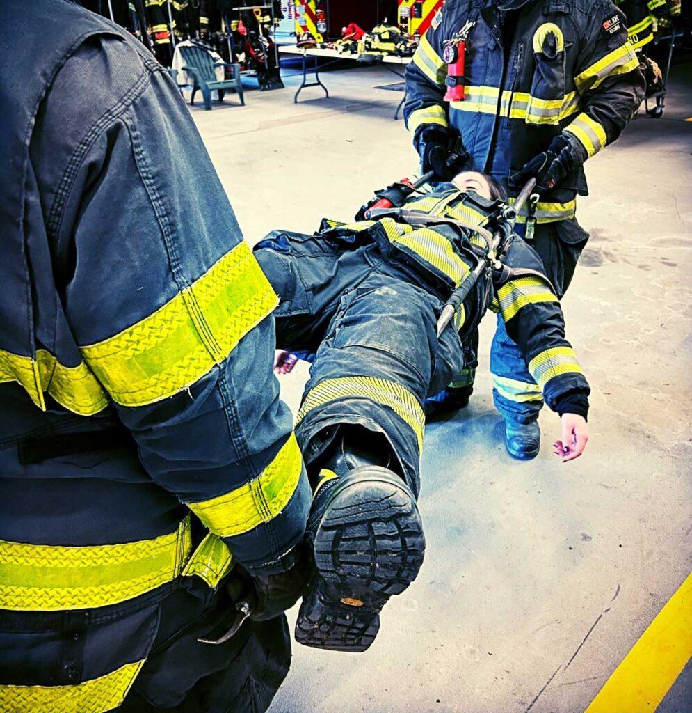 firefighters use hooks to create litter to transport down member