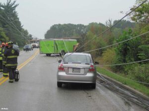 Indianapolis firefighters respond to a 2015 incident in which a driver is trapped inside a car trapped under multiple high-voltage power lines