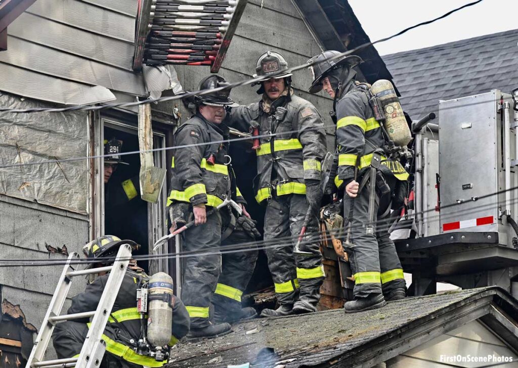 FDNY firefighters on roof at house fire