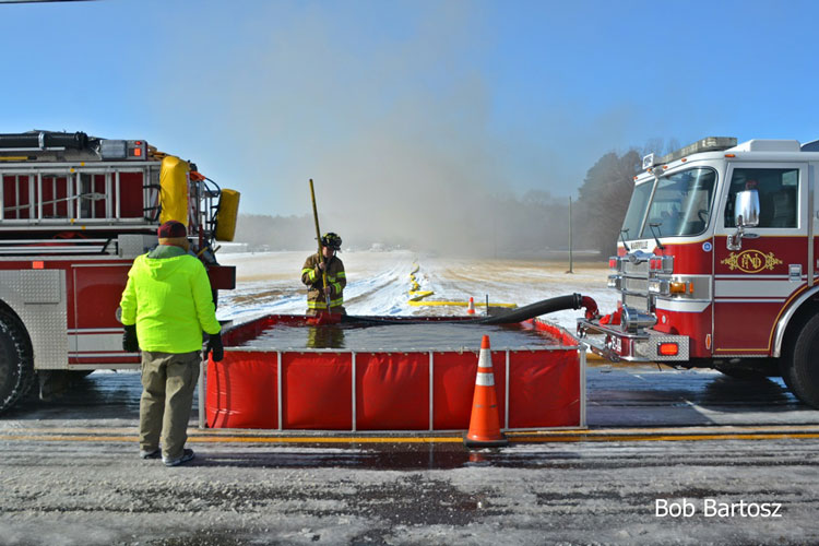 Firefighters with dump tank