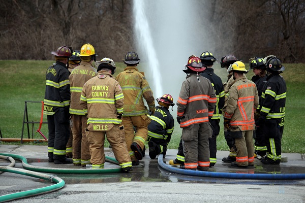 Firefighters with hoselines