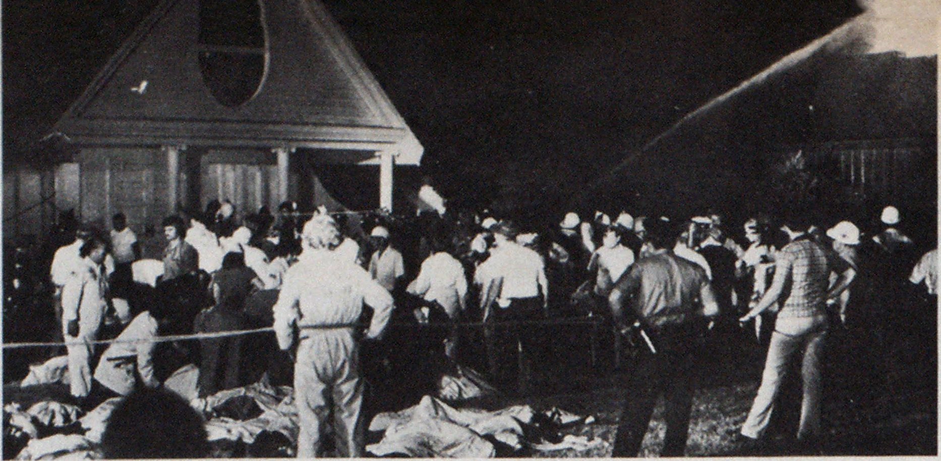 Bodies are removed from club garden to a temporary morgue in Fort Thomas armory.