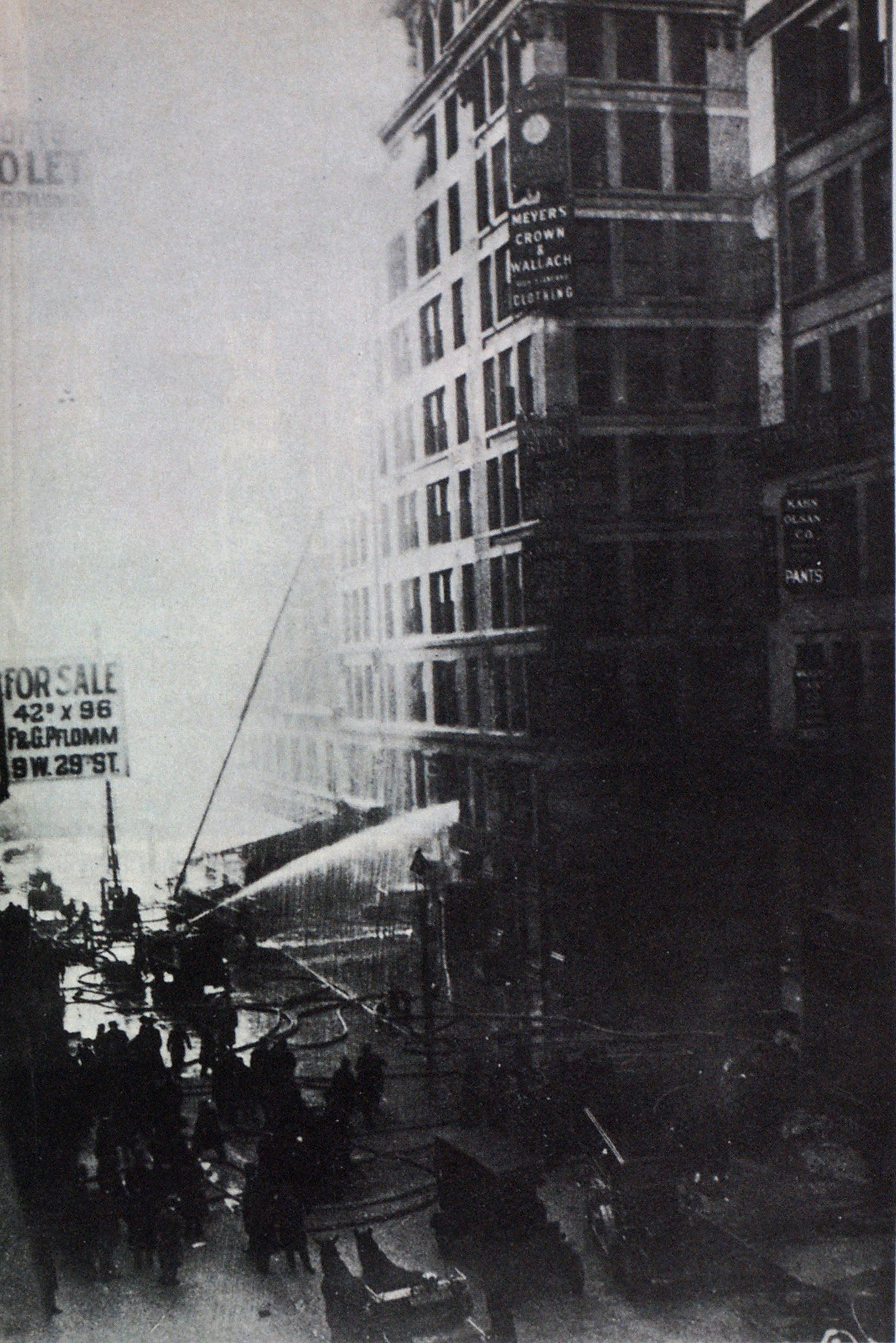 Hose lines and apparatus are shown in operation at Triangle Shirtwaist fire