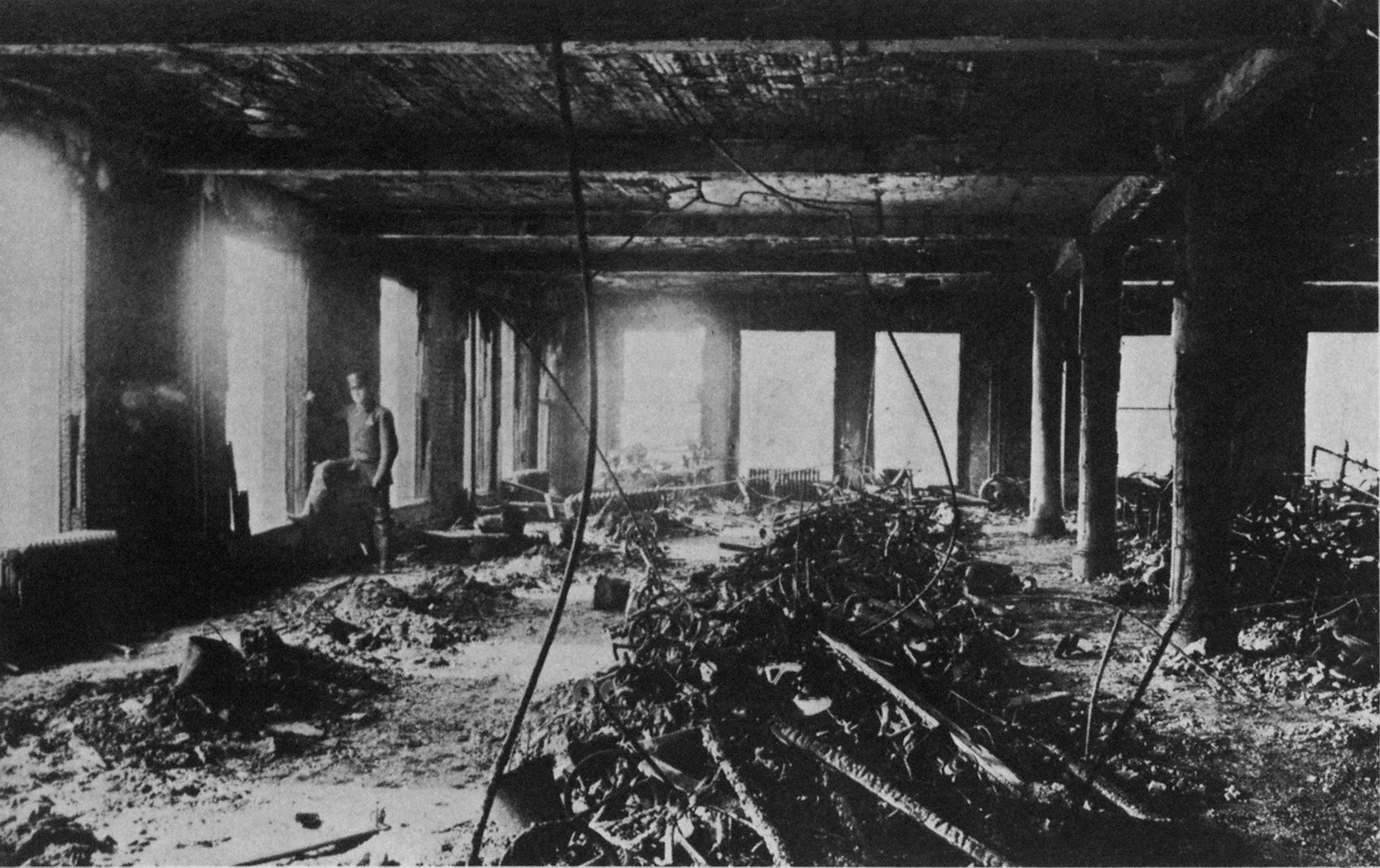 Intensity of fire, which was knocked down 18 minutes after the alarm, is indicated in this view Of Triangle Waist Company workroom