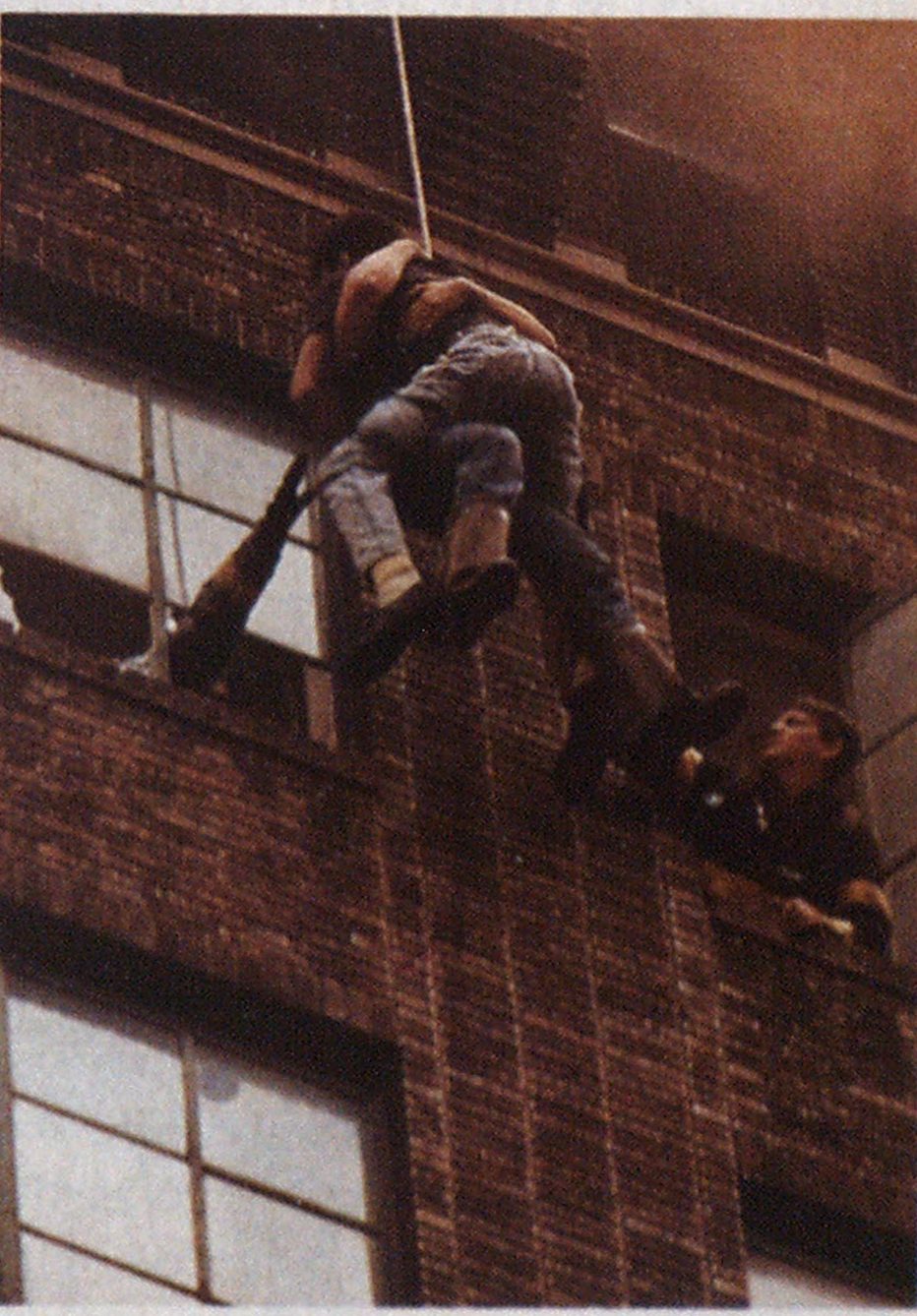 In a panic, the first victim jumped onto Firefighter Barr, placing an extreme impact load on the life-saving rope.